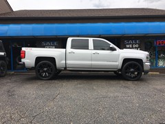 2016 Chevy Silverado 1500 with 24 inch KMC Slide wheels and 285/40/24 Atturo tires