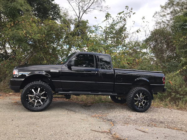 2009 Ford Ranger with a 5in. Rough Country Lift, 20x9 Motometal 970’s, 33x12.50x20 Nitto Ridge Grapplers, custom smoked lights and more! 