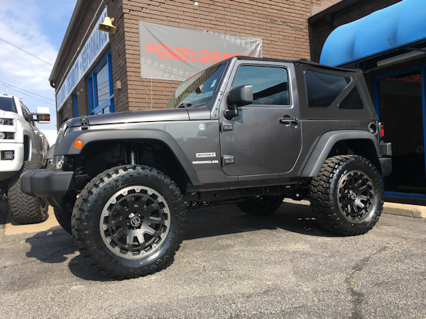 2017 Jeep Wrangler with 3 inch Zone Offroad lift kit with 20 inch Black Rhino Razorback wheels and 35 inch Ironman MT tires 
