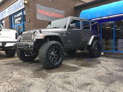 2016 Jeep Wrangler with 4 inch Zone Offroad lift kit withFox shocks and 20x10 Fuel Maverick wheels with 37 inchNitto Ridge Grappler tires and Teraflex HD spare tire mount
