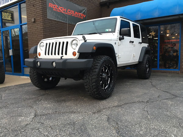 2013 Jeep Wrangler with 3 inch Zone Offroad lift kit and 20x9 Moto Metal MO962 wheels with 35 inch Mastercraft Courser MXT tires 