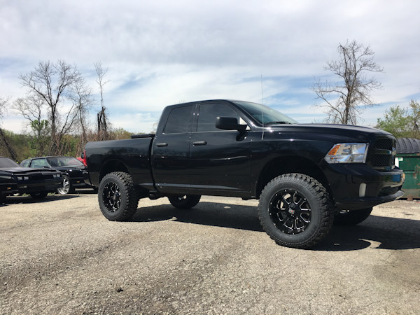 2016 Ram 1500 with 6 inch Zone Offroad lift kit and 20x10 XD Buck wheels with 37 inch Radar MT tires 