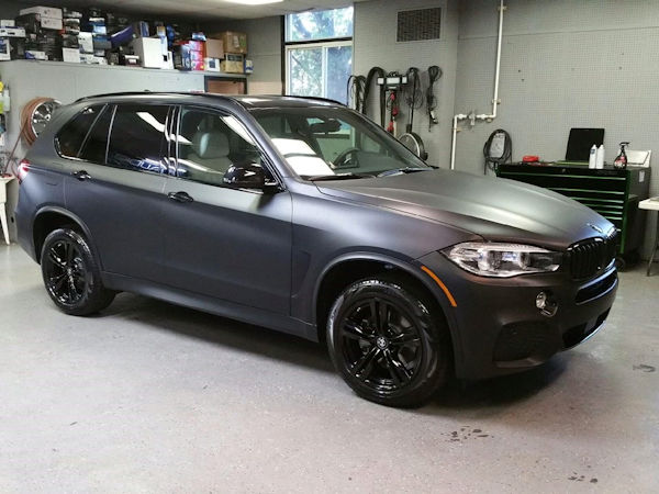 2016 BMW X5 with 3M vinyl wrap and powder coat OEM wheels gloss black. 