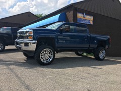 2016 Chevy Silverado 2500 with 6 inch Rough Country lift kit and 22x12 Hostile Sprocket wheels with 35 inch RBP tires