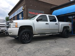 2011 Chevy Silverado 1500 with 3 inch Rough Country lift kit and 20 inch Moto Metal MO970 wheels and 33 inch Radar Renegade MT tires