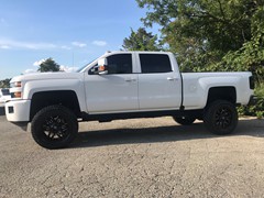 2018 Chevy 2500, 4.5in BDS Lift, 20x9 +20 offset Fuel Sledge ,35x12.50x20 Toyo Open Country A/T 2, and custom painted grill and chrome delete