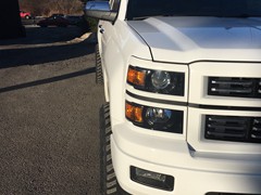 2015 Chevy Silverado 1500 with Rough Country 3.5 inch lift kit with 20x10 inch American Truxx AT162 Vortex wheels and 33 inch Atturo Trail Blade MT tires