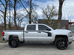 Chevy1500 with a 3in. Rough County lift, 22x10 Gloss Black Fuel Mavericks and 33x12.50x22 Radar R7 M/T’s