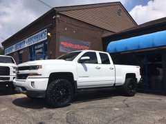 2016 Chevy Silverado 1500 with a 3 inch Rough Country lift kit and 20x9 KMC XD Grenade wheels and 33 inch Nitto Trail Grappler tires