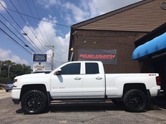 2016 Chevy Silverado 1500 with a 3 inch Rough Country lift kit and 20x9 KMC XD Grenade wheels and 33 inch Nitto Trail Grappler tires
