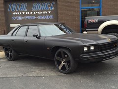 1976 Chevy Caprice with flat black paint, full custom red interior, full custom JL Audio stereo system with 2 10 inch W3 subs, C2 speakers and JX amps, 22 inch Dub Baller wheels