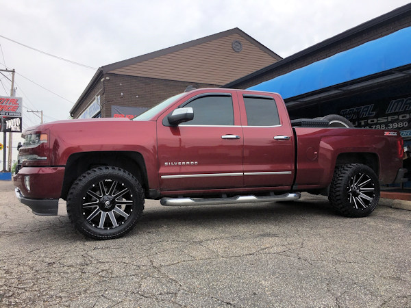 2016 Chevy Silverado with Rough Country leveling kit and 20x10 Fuel Offroad Contra wheels with 33 inch Radar MT tires 