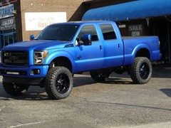 2013 Ford F-250 in for Oracle Led Halo headlights, LED concepts light bar, Rave Sport HID Kit, Rigid Industries Rock lighting, custom blue tinting on wheels, F250 emblems