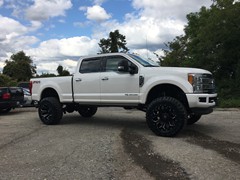 2017 Ford F-350 with a 6 inch Zone Offroad lift kit with Fox shocks and Steering Stabilizer with 22x12 Fuel Offroad Assault wheels and 37 inch Toyo Open Country MT tires with AFE 5 inch exhaust and BAK Industries MX tonneau cover