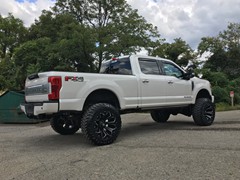 2017 Ford F-350 with a 6 inch Zone Offroad lift kit with Fox shocks and Steering Stabilizer with 22x12 Fuel Offroad Assault wheels and 37 inch Toyo Open Country MT tires with AFE 5 inch exhaust and BAK Industries MX tonneau cover