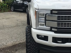 2017 Ford F-350 with a 6 inch Zone Offroad lift kit with Fox shocks and Steering Stabilizer with 22x12 Fuel Offroad Assault wheels and 37 inch Toyo Open Country MT tires with AFE 5 inch exhaust and BAK Industries MX tonneau cover