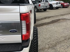 2017 Ford F-350 with a 6 inch Zone Offroad lift kit with Fox shocks and Steering Stabilizer with 22x12 Fuel Offroad Assault wheels and 37 inch Toyo Open Country MT tires with AFE 5 inch exhaust and BAK Industries MX tonneau cover