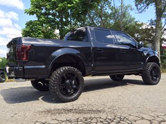 2015 Ford F-150 with 6 inch BDS lift kit, 22 inch KMC XD Rockstar 2 wheels and 35 inch Nitto Trail Grappler tires with a Borla Atak exhaust