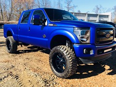 Cam Thomas of the kanas city chiefs, 2012 F250 , wrapped in 3m Satin Mystic Blue, 6in. Rough Country Lift, custom painted 22in. Fuel Maverick, 37x13.50x22 Toyo Open Country M/T, Full JL audio system with 4-12w6’s in the bed, and key start converted to a push button start