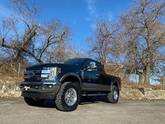 2019 Ford F-250 with 2.5 inch Readylift leveling kit and 20x9 Fuel Offroad Titan wheels and 37 inch Nitto Ridge Grappler tires and Flowmaster Force II exhaust