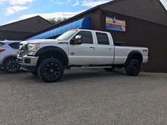 2016 Ford F-350 with a 4 inch Zone Offroad lift kit and 20 inch TIS 534B wheels and 35 inch Nitto Terra Grappler tires