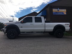 2016 Ford F-350 with a 4 inch Zone Offroad lift kit and 20 inch TIS 534B wheels and 35 inch Nitto Terra Grappler tires
