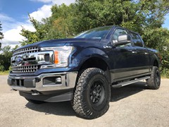 2018 Ford F150 , with Bilstein 5100’s and add a leaf in the rear, Black Rihno 18x9 wheels, and 295/60/20 Ridge Grapplers
