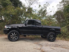 2009 Ford Ranger with a 5in. Rough Country Lift, 20x9 Motometal 970’s, 33x12.50x20 Nitto Ridge Grapplers, custom smoked lights and more!