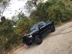 2009 Ford Ranger with a 5in. Rough Country Lift, 20x9 Motometal 970’s, 33x12.50x20 Nitto Ridge Grapplers, custom smoked lights and more!
