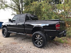 2009 Ford Ranger with a 5in. Rough Country Lift, 20x9 Motometal 970’s, 33x12.50x20 Nitto Ridge Grapplers, custom smoked lights and more!