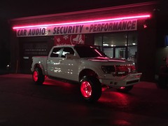 2014 Ford Raptor with 20x12 Fueloffroad 2 piece Fuel Blown wheels with custom powder coat finish and 35 inch Toyo Open Country RT tires.  54 inch Rigid Industries RDS LED light bar with red covers, Racesport Lighting RGB LED wheel lights