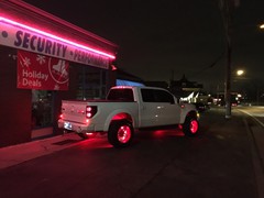 2014 Ford Raptor with 20x12 Fueloffroad 2 piece Fuel Blown wheels with custom powder coat finish and 35 inch Toyo Open Country RT tires.  54 inch Rigid Industries RDS LED light bar with red covers, Racesport Lighting RGB LED wheel lights