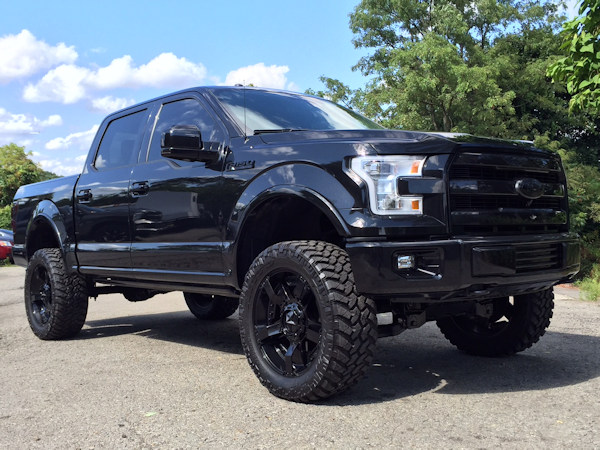 2015 Ford F-150 with 6 inch BDS lift kit, 22 inch KMC XD Rockstar 2 wheels and 35 inch Nitto Trail Grappler tires with a Borla Atak exhaust 