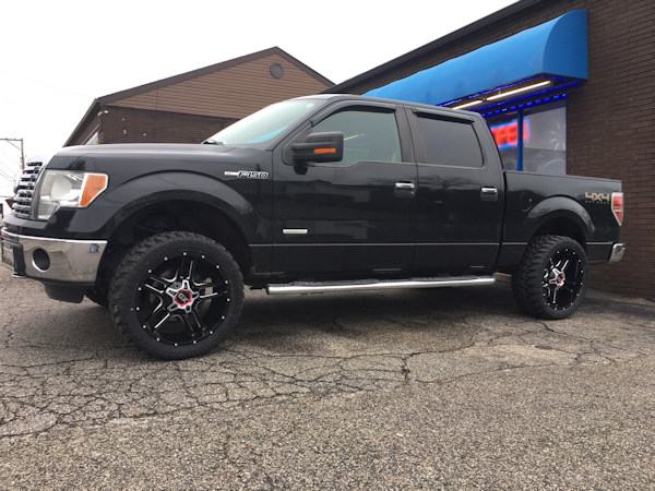 Ford F-150 with 2 inch Rough Country leveling kit and 22x10 XD839 wheels and 33 inch Radar Renegade MT tires 