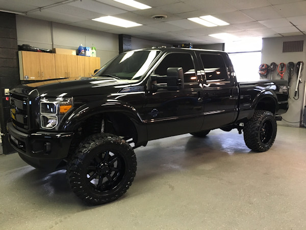 2013 Ford F-250 in for Oracle Led Halo headlights, LED concepts light bar, Rave Sport HID Kit, Rigid Industries Rock lighting, custom blue tinting on wheels, F250 emblems 