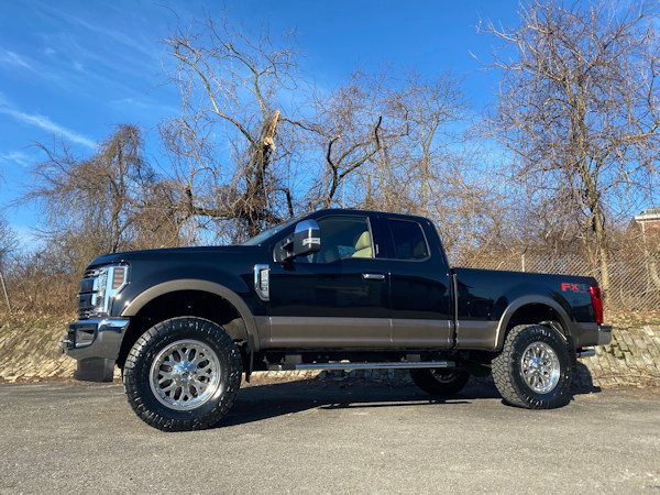 2019 Ford F-250 with 2.5 inch Readylift leveling kit and 20x9 Fuel Offroad Titan wheels and 37 inch Nitto Ridge Grappler tires and Flowmaster Force II exhaust 