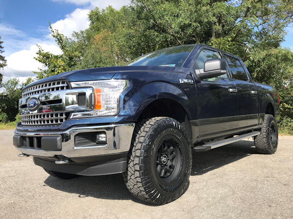 2018 Ford F150 , with Bilstein 5100’s and add a leaf in the rear, Black Rihno 18x9 wheels, and 295/60/20 Ridge Grapplers 