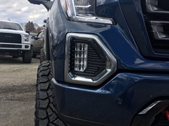 2019 GMC Sierra AT4 with 4 inch Rough Country lift kit and 20x10 KMC XD Hoss 2 wheels and 35 inch Nitto Ridge Grappler tires