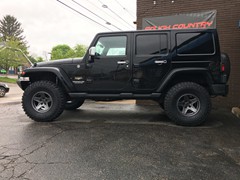 2011 Jeep Wrangler with 3 inch Zone Offroad lift kit and 17 inch Mammoth wheels with 35 inch Mickey Thompson tires