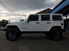 2015 Jeep Wrangler with a 3 inch Zone Offroad lift kit with 20x10 Fuel Offroad Assault wheels and 35 inch Radar Renegade MT tires