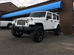 2015 Jeep Wrangler with a 3 inch Zone Offroad lift kit with 20x10 Fuel Offroad Assault wheels and 35 inch Radar Renegade MT tires