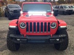2018 Jeep Wrangler JL with 2.5 inch Rough Country lift kit and 20x10 Fuel Assault wheels and 35 Nitto Ridge Grappler tires and Rough Country LED lighting and nerf steps.