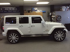 2014 Jeep Wrangler with 24 inch Helo 875 wheels, Nitto Terra Grappler tires 285/40/24.  Front and rear bumpers, mirrors, door handles, all trim and wheel inserts painted to match.  J-02241401
