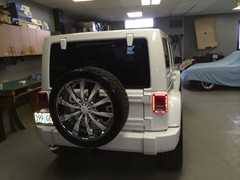 2014 Jeep Wrangler with 24 inch Helo 875 wheels, Nitto Terra Grappler tires 285/40/24.  Front and rear bumpers, mirrors, door handles, all trim and wheel inserts painted to match.  J-02241402
