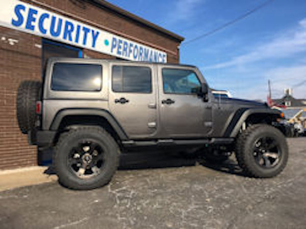 2017 Jeep Wrangler with a 4 inch Zone Offroad lift kit and Fox shocks and 20 inch Fuel Offroad Beast wheels and 37 inch Radar Renegade MT tires and Teraflex HD spare tire mount 