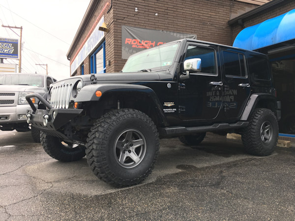 2011 Jeep Wrangler with 3 inch Zone Offroad lift kit and 17 inch Mammoth wheels with 35 inch Mickey Thompson tires 