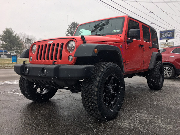 2017 Jeep Wrangler with 3.5 inch Metal Cloak lift kit and 20 inch Fuel Offroad Hostage wheels and 35 inch Nitto Trail Grappler tires. 
