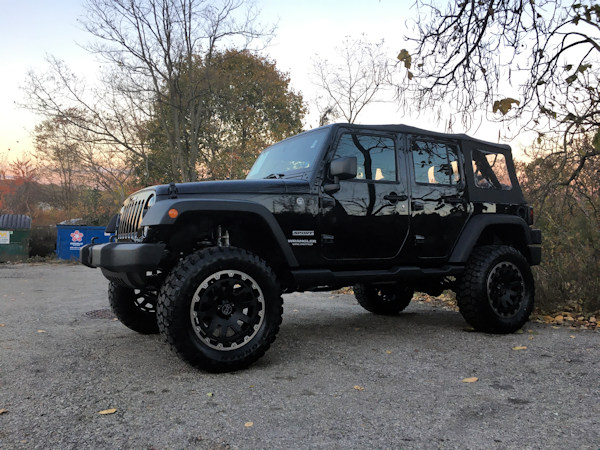 2017 Jeep Wrangler with 4 inch Zone Offroad lift and 20 inch Black Rhino Razorback wheels and 35 inch Ironman MT tires 