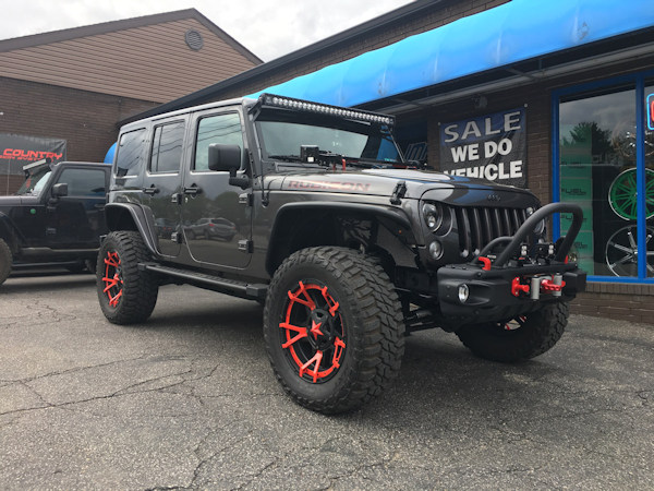 2016 Jeep Wrangler Rubicon with a 3 inch Zone Offroad lift kit with upgraded Fox shocks and 20 inch XD Rockstar 3 wheels with 35 inch Mastercraft MXT tires.  50 inch Rigid Industries Radiance LED light bar, JW Speaker LED headlights and tail lights, Wa... 