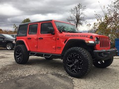 2018 Jeep Wrangler JL with 2.5 Rough Country lift kit and 20x9 Fuel Offroad Assault wheels with 35 inch Nitto Ridge Grappler tires and Rough Country nerf bars and Rough Country LED light bar and pod lights